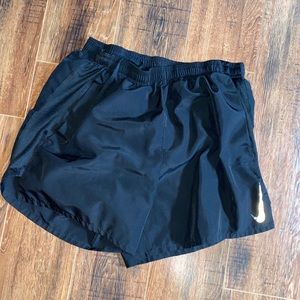 Black Nike running shorts